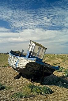 Images Dated 13th July 2007: Abandoned Boat on shore - Dungeness, Kent. The beach at Dungeness looks like a dumping ground