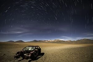 Abandoned Car with star trails in the sky