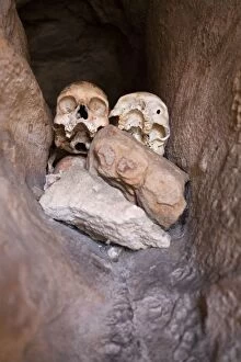 Aborigine Gallery: Aboriginal skulls in burial crevice Bigge Island
