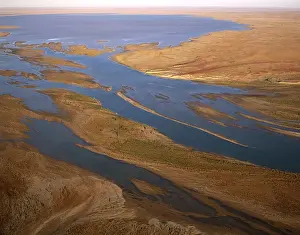 Aerial - Margaret River flowing into L. Eyre South Lake Eyre National Park, South Australia JPF46553
