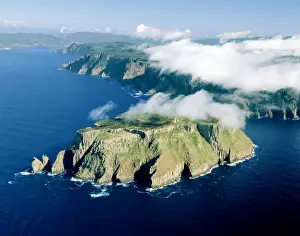 Aerial - Tasman Island and Cape Pillar with Tasman Island Lighthouse, Tasman National Park, Tasman Peninsula, Tasmania, Australia JPF49789
