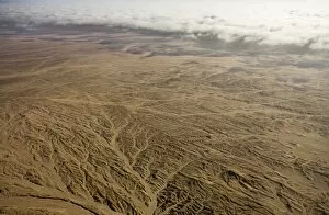 Aerial view of mist rolling in from the cold Atlantic Ocean over the Namib Desert Plains