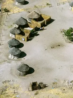 Aerial view of thatched rondavels made of mud and straw in a typical African village. Maun, Botswana