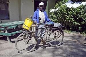 African man with self built gadget bicycle