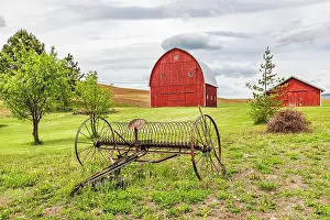 Equipment Prints: Albion, Washington State, USA. Red barns and antique farm equipment in the Palouse hills