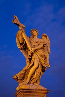 One of the Angel statues at dusk along Ponte