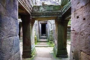 Temples Gallery: Arched walkways and pillars in the ruins of the Bayon Kh