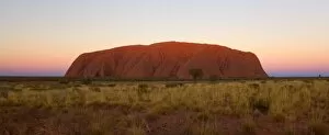 Images Dated 31st May 2008: Ayers Rock - Uluru - shortly after sunset. The sky is awash in colours from blue to pink