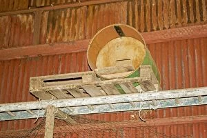 Barn owl nesting box made from oil drum in barn