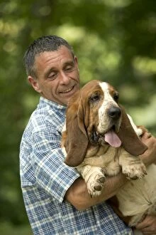 Images Dated 25th June 2005: Basset Hound - owner carrying dog