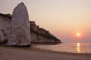 Images Dated 7th May 2006: Beach of Vieste with chalk cliffs and symbol Pizzomunno at sunrise Gargano Peninsula, Italy
