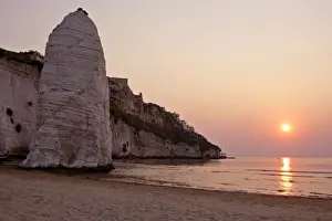 Romance Prints: Beach of Vieste with chalk cliffs and symbol Pizzomunno at sunrise Gargano Peninsula