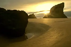 Evening Prints: Bedruthen Steps view towards sea stacks from beach at low tide Cornwall, England, UK