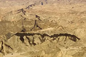 Dyke Prints: Black dolerite dykes clearly visible as they cut through the rocky terrain of the Moon Valley near Swakopmund - Namib