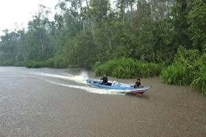 Images Dated 9th November 2008: boat on Sekonyer river with heavy rain