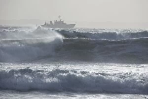 Boat out in stormy sea, Brittany, France