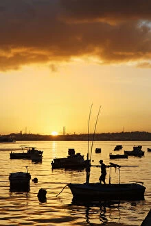 Boats silhouetted at sunrise, Havana Harbor