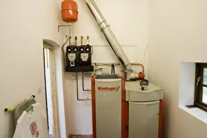 Cottage Prints: Boiler - Windhager Austrian wood pellet fired domestic biomass boiler produces heat for thermal store using small wood