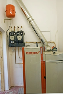 Images Dated 31st August 2007: Bolier - Windhager Austrian wood pellet fired domestic biomass boiler produces heat for thermal