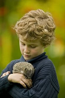 Boy - age 6 - holding orphaned hedgehog