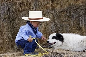 Images Dated 2nd September 2005: Boy playing at being a cowboy with Border Collie