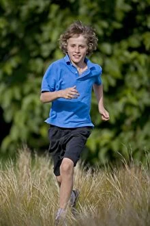 Images Dated 4th August 2007: Boy Running in Field - Age 10