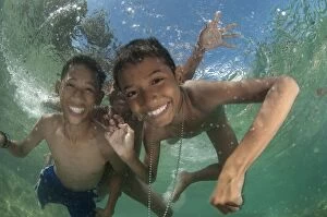 Images Dated 29th November 2006: Boys playing underwater in shallow water