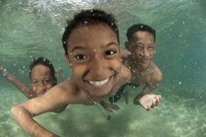 Ambon Gallery: Boys playing underwater in shallow water