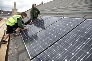 Alternative Gallery: Builders installlation solar PV panels on slate