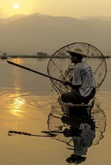 Burma Gallery: Burmese Fisherman fishing at dawn