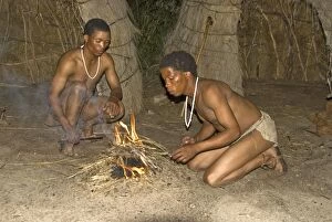 Bushmen Gallery: Bushman - two bushman with newly lit fire