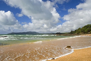 Images Dated 28th March 2008: Cable Bay waves rolling in on the golden beach of Cable Bay before a thunderstorm Cable Bay
