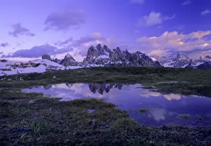 Dolomite Prints: Cadini Group mountains of cadini group with small pool and reflection in late evening light Dolomites