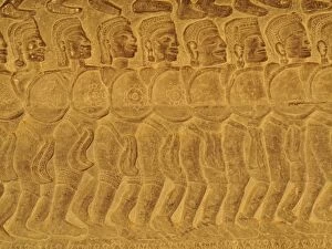 Cambodia - Bas-reliefs of warriors at the east