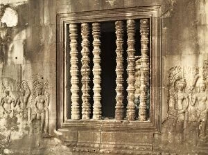 Colonettes Gallery: Cambodia - Window with colonettes and Devatas (deity)