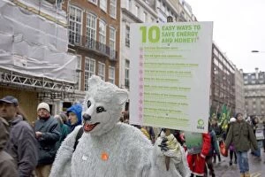 Images Dated 8th December 2007: Campaigner in bear costume with Energy Saving banner