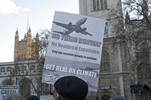 Demonstration Gallery: Campaigners with banner no third runway on Climate