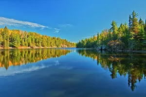 Images Dated 25th May 2021: Canada, Ontario. Forest reflections on Blindfold Lake in autumn. Date: 10-10-2020