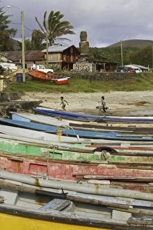 Images Dated 31st October 2004: Canoes drawn up on beach, and children. Hanga Roa