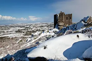 Buildings Prints: Carn Brea castle - in snow - looking east to Redruth and beyond - Cornwall - UK