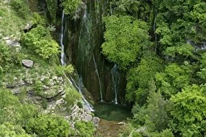 Cascata del Marmore - water cascading down moss covered steep cliffs into a cistern