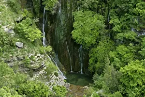 Tank Prints: Cascata del Marmore water cascading down moss covered steep cliffs into a cistern near Bolognano