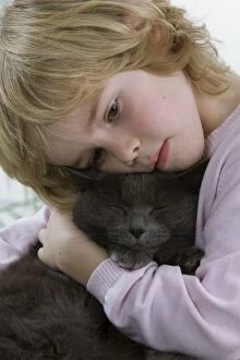 Images Dated 21st November 2010: Cat - being cuddled by young child
