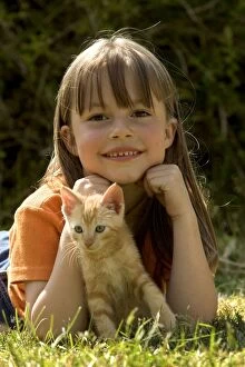 Cat - girl with ginger tabby kitten