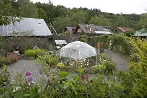 Centre for Alternative Technology, UK - situated in an old slate quarry at Machynlleth in Mid-Wales the centre demonstrates a wide range of sustainable systems. This image shows a greenhouse, low energy house and photovoltaic roof