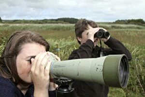 Binoculars Gallery: Children birdwatching - looking through telescope
