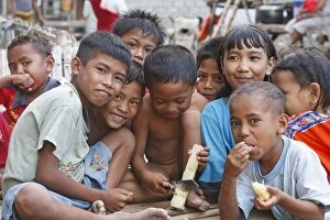 Children in Komodo Village - eating sugar cane