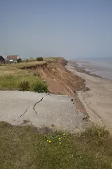 Collapsed Prints: Collapsed tarmac road following cliff erosion on coast East Newton East Riding of Yorkshire UK
