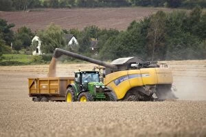 Images Dated 14th September 2012: Combine Harvester - emptying grain into trailer