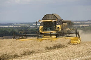 Farm Collection: Combine harvesting in the village of Stanton, Cotswolds, UK